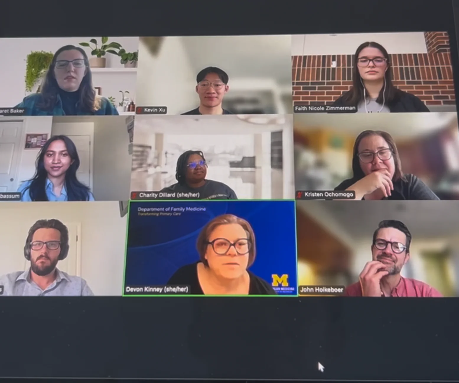 A video call of nine tiles: the four designers and the department's administrators and managers, one on a Family Medicine background.
